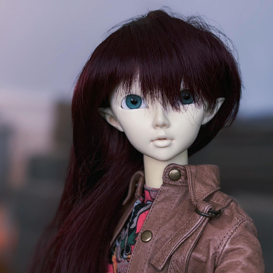 unpainted Cerberus Project Delf Juri 05 with dark red hair and sea green eyes wearing a brown leather jacket