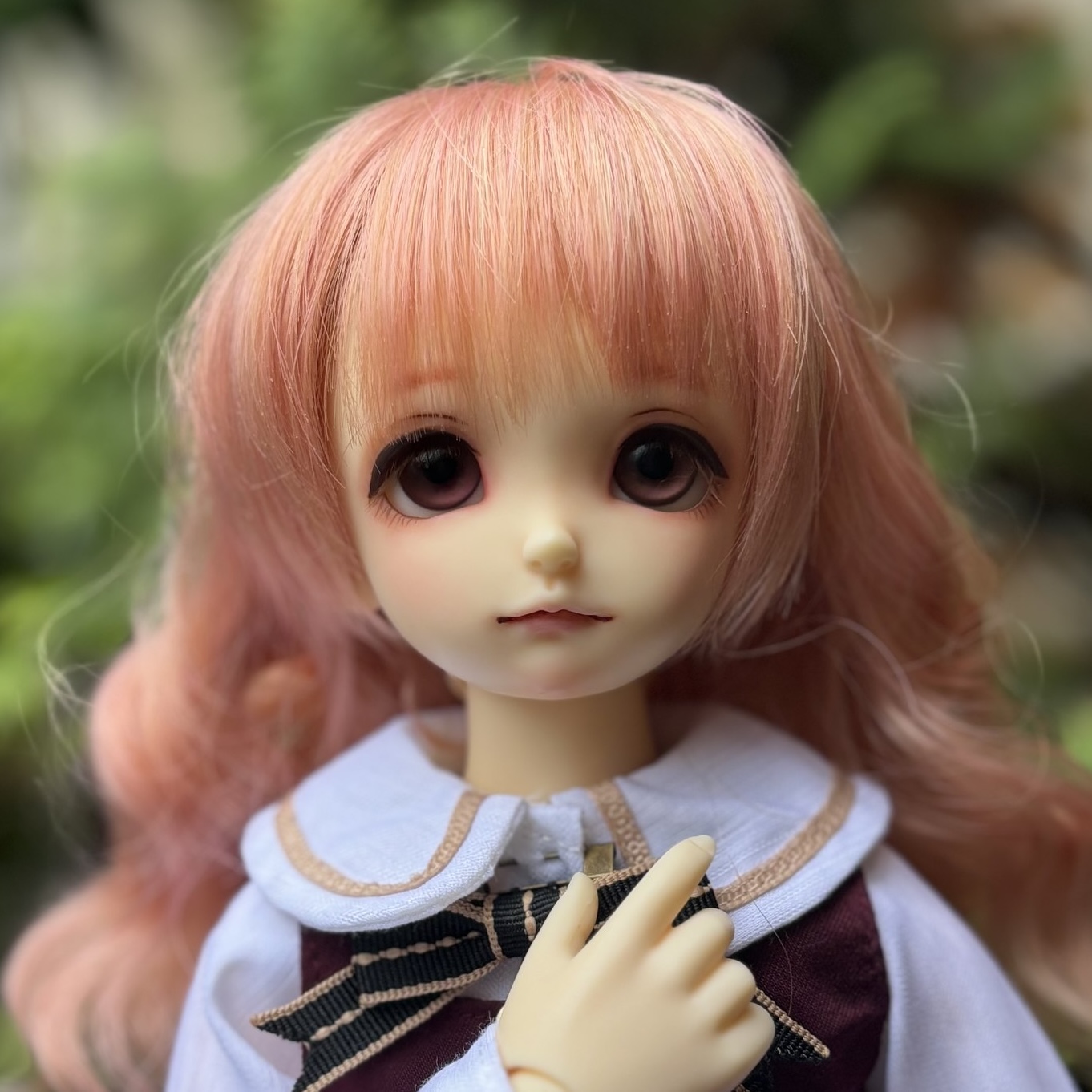 45cm BJD girl with maroon eyes and strawberry pink-blonde hair wearing a cute dress