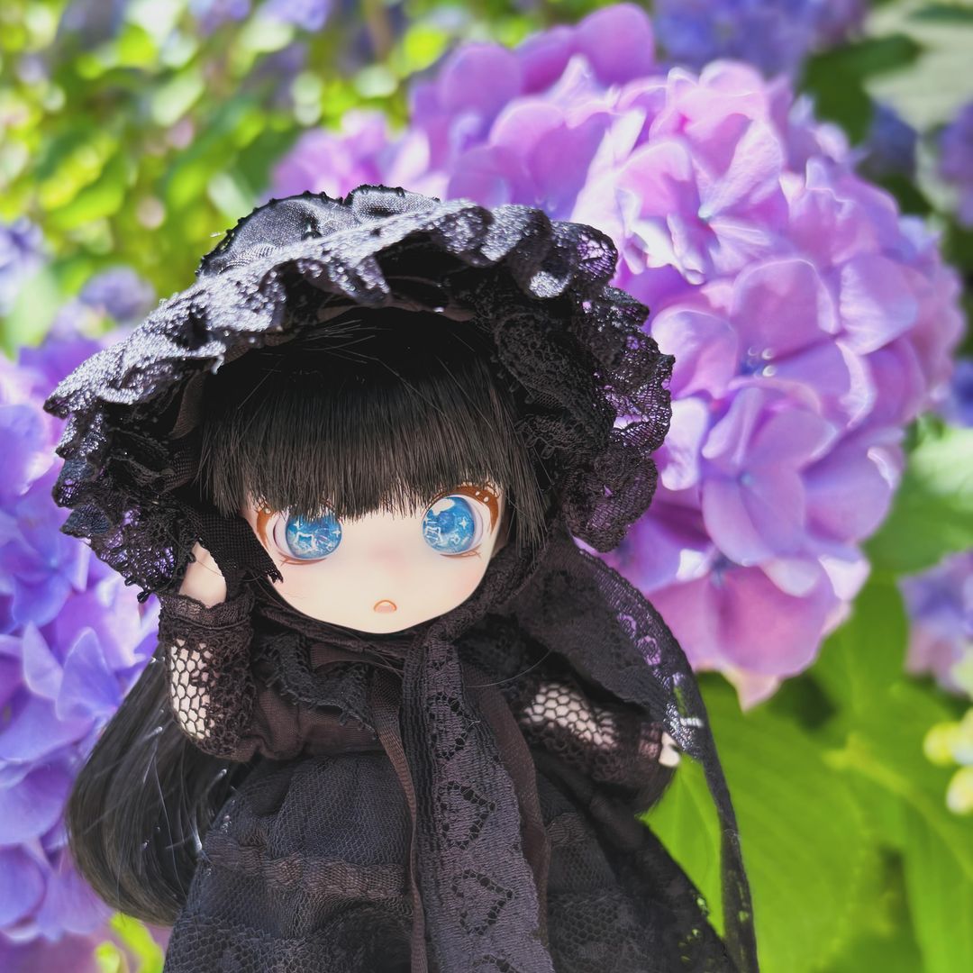 1:12 scale MJD with blue eyes and long black hair wearing a black Gothic Lolita outfit